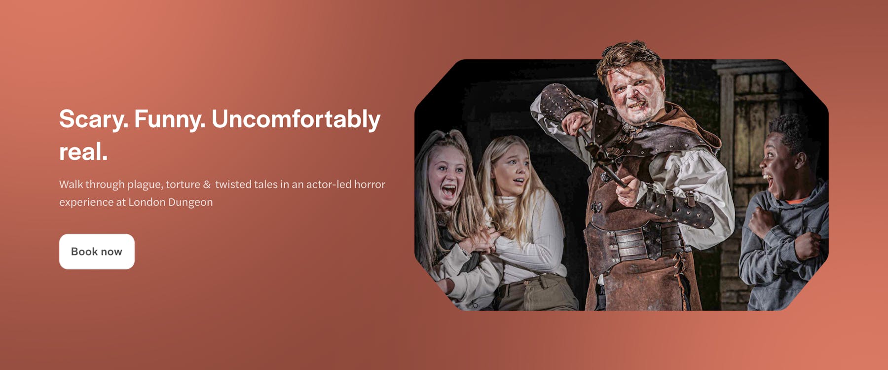 Actor-led horror scene at London Dungeon with frightened visitors.